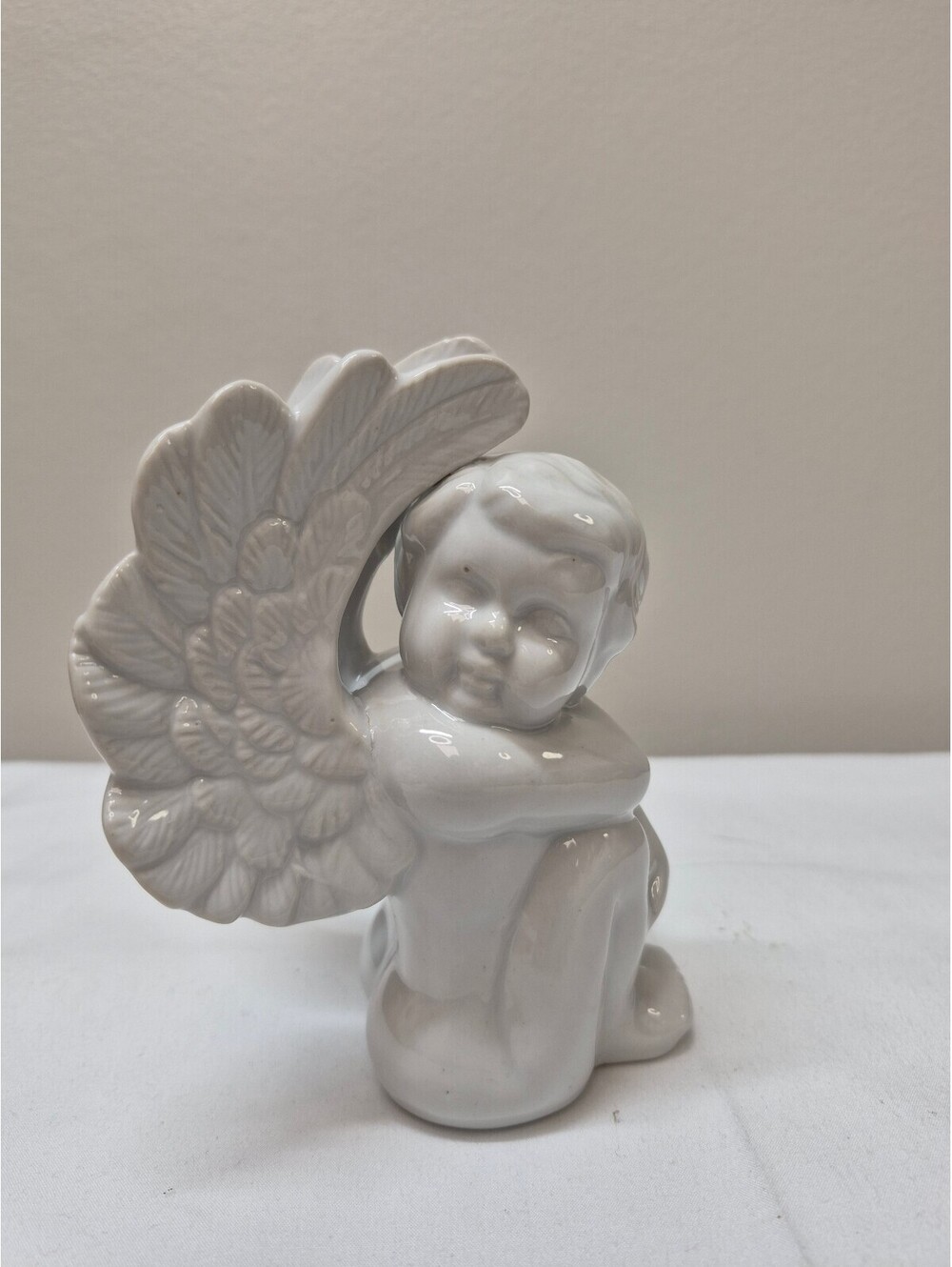 White Ceramic Angel Figurine with Detailed Wings J11